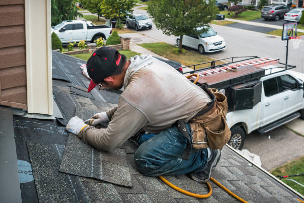 Professional Emergency Roof Repair technician working in Johnson City, KS